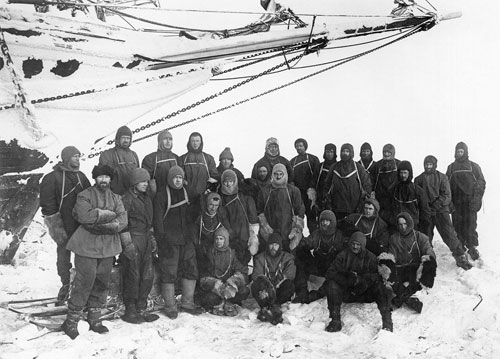 Group portrait, with uncrushed ship in background (taken earlier)